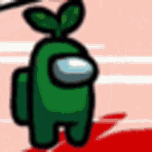 a green among us character with green leaves on its head is standing on a red surface .