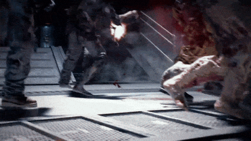 a group of soldiers are fighting a monster in a room