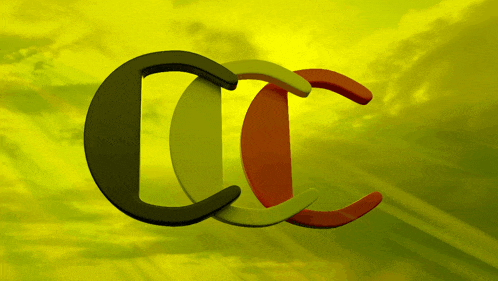 a green red and black cc logo with a yellow sky in the background