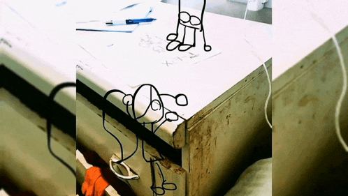 a drawing of a chair sits on a table next to a drawing of a person