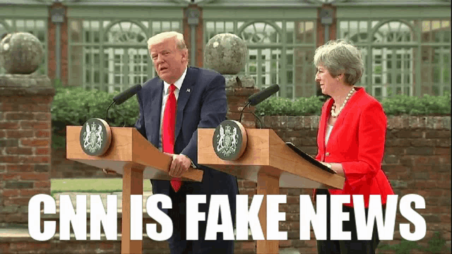 cnn is fake news is written on a picture of two people standing at podiums