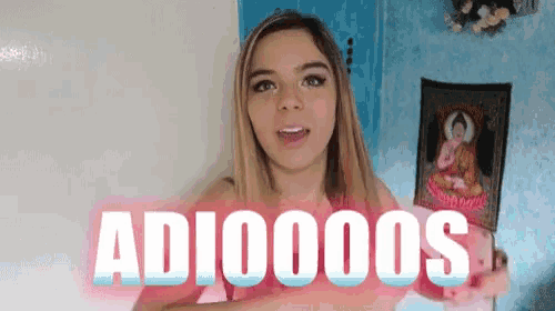 a girl with a picture of a buddha behind her says adi00000s