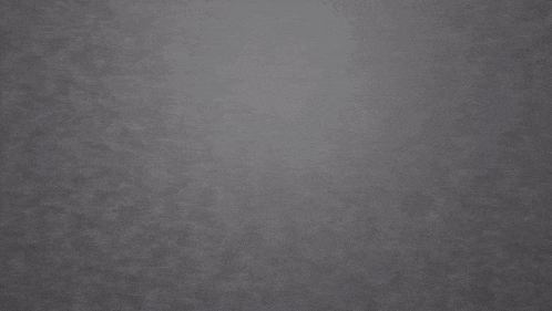 a 3d rendering of a soccer ball breaking through a rock wall