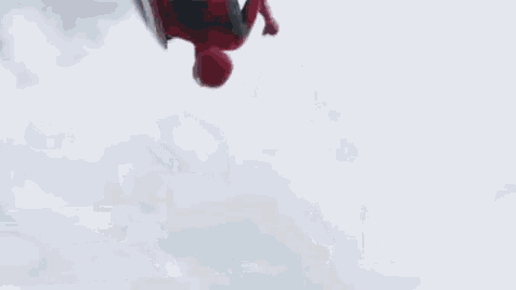 spider-man is holding a captain america shield in the air