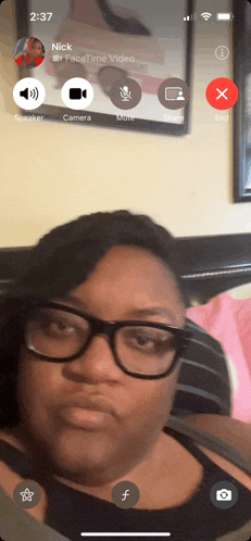 a woman wearing glasses is on a video call with a man named nick