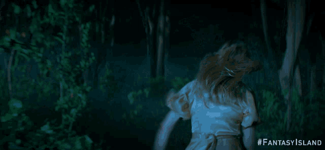 a woman in a white dress is running through a dark forest with #fantasy island on the bottom