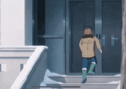 a person is walking down a set of stairs in the snow .