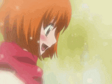 a close up of a girl with orange hair wearing a red scarf and smiling .