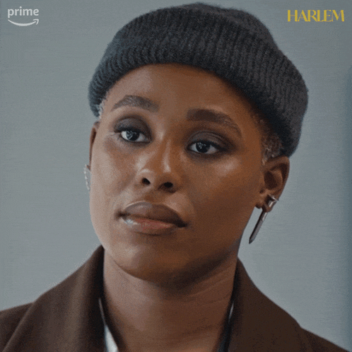 a close up of a woman 's face with the words harlem on the bottom