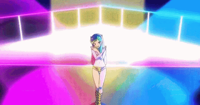 a girl in a bikini is standing in front of a stage with a rainbow of lights .