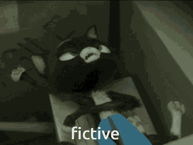 a cartoon cat laying on a table with the word fictive above it