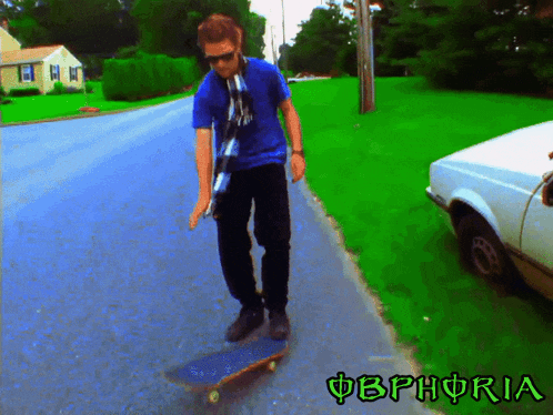 a man is riding a skateboard down a street with the word obphoria in green