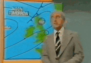 a man in a suit and tie stands in front of a screen that says pressure at 6pm