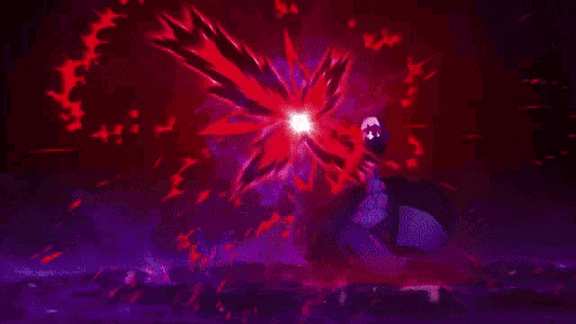 a blurry picture of a red flower with a purple background