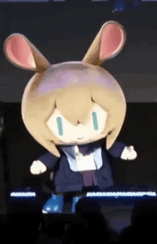 a stuffed animal with bunny ears is dancing on a stage in front of a crowd .