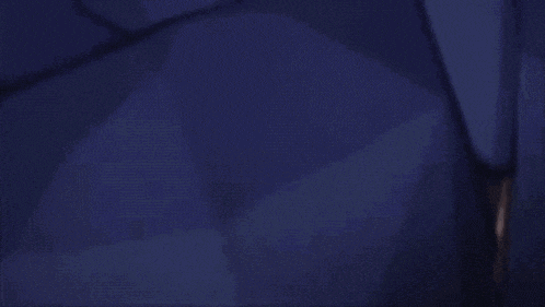a pixelated image of a person holding a sword in a dark room