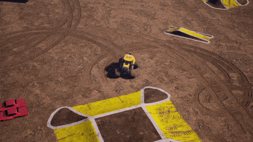 a monster truck is driving on a dirt road