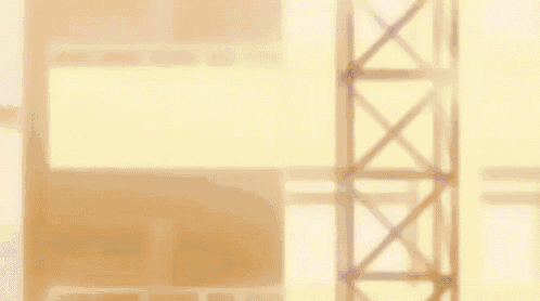 a close up of a person 's face with a yellow background and a crane in the background .
