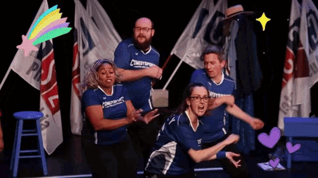 a group of people wearing blue shirts that say comestop