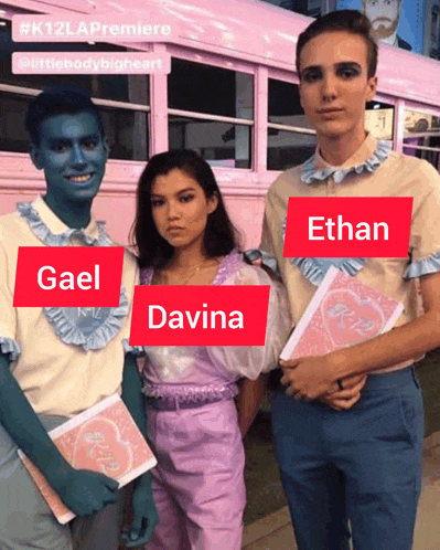 a group of people standing next to each other with one of them holding a book that says r.i.p