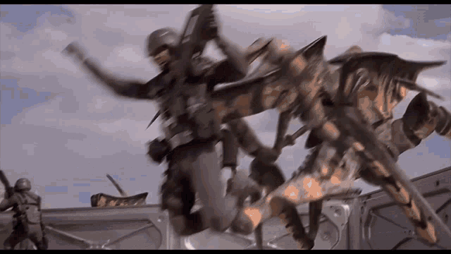 a group of soldiers are jumping in the air while fighting a monster .