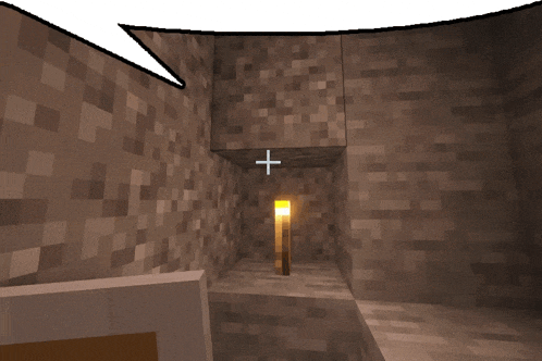 a screenshot of a minecraft game shows a torch in the middle of a cave