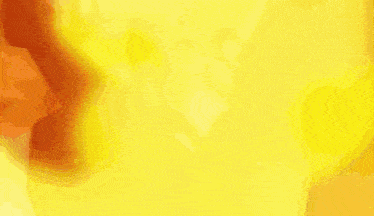 a yellow and orange background with a blurred image