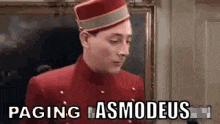 a man in a red uniform and hat is standing in front of a painting and says paging asmodeus .