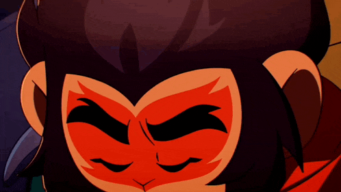 a close up of a cartoon character with a red face and yellow eyes