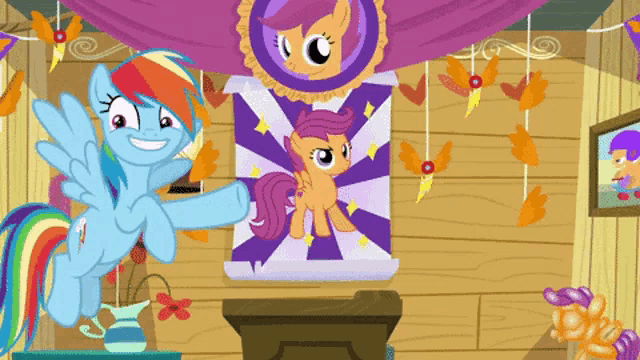 rainbow dash and scootaloo are standing in front of a poster