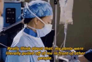 a surgeon wearing a surgical gown and mask says really think about that my pants were literally pulled off of me