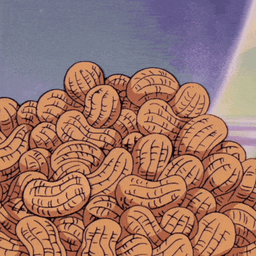 a pile of peanuts with a purple background