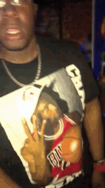 a man is wearing a shirt with a picture of michael jordan