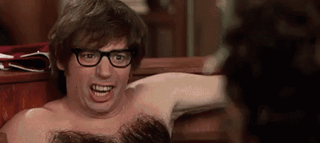 a shirtless man with glasses is making a funny face while sitting on a bench .