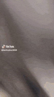 a blurred image of a person 's face with a tiktok watermark