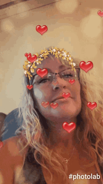 a photo of a woman with hearts on her face and the hashtag #photolab at the bottom