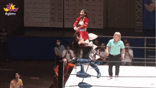 two women are wrestling in a ring with the hashtag #gtmv on the bottom