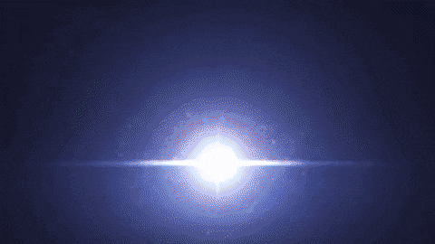 a blue explosion with smoke coming out of it in the dark