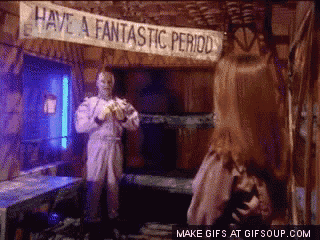 a sign that says have a fantastic period hangs above a woman