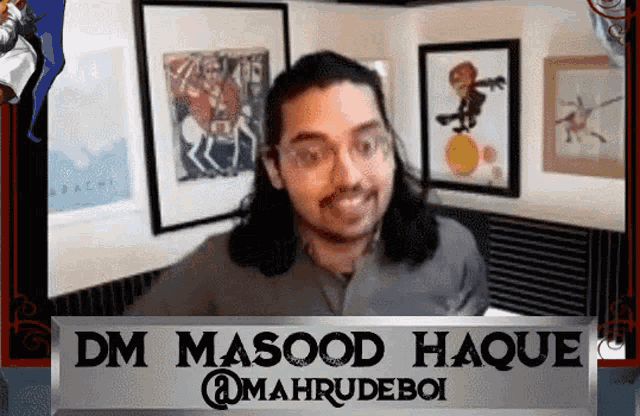a man with long hair is smiling in front of a sign that says dm masood haque @mahrudeboi