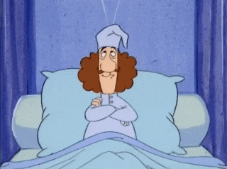 a cartoon character is laying in bed with his arms crossed and wearing a sleep cap