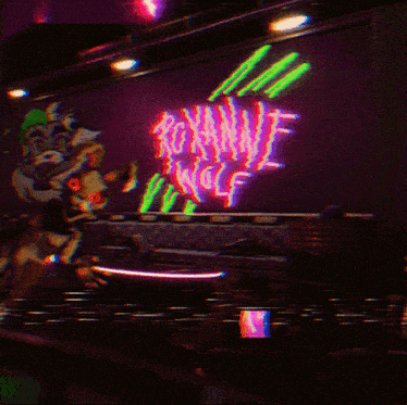 a neon sign that says roxanne wolf is lit up in a dark room