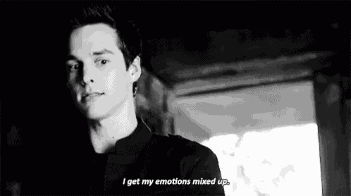 a black and white photo of a man with the words `` i get my emotions mixed up '' .