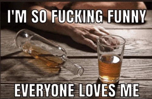 a bottle of whiskey and a glass of whiskey on a table