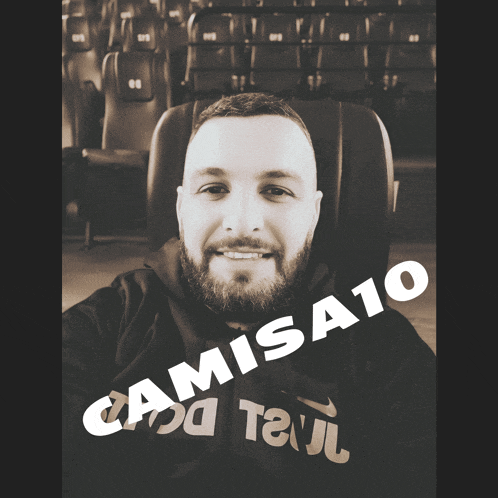 a man with a beard is wearing a shirt that says camisa10 on it