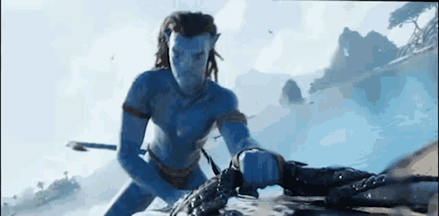 a man in a blue suit is holding a rope in his hand .