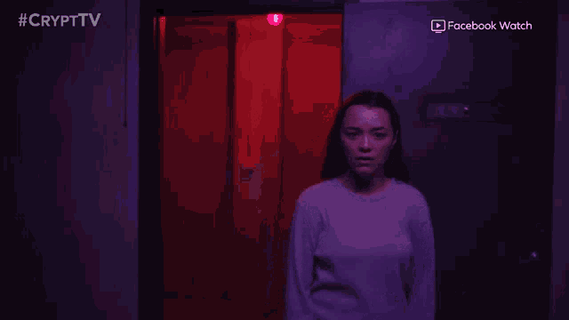 a woman is standing in a dark room with the words what are you doing to her on the bottom