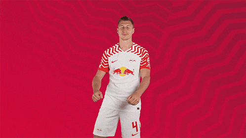 a soccer player wearing a red and white jersey with the number 9 on it