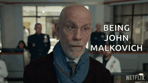 a bald man wearing glasses and a scarf says being john malkovich .
