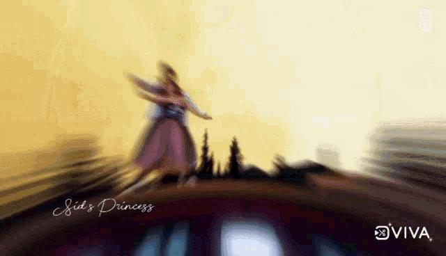 a blurred image of a woman dancing with the words sid 's princess written below her